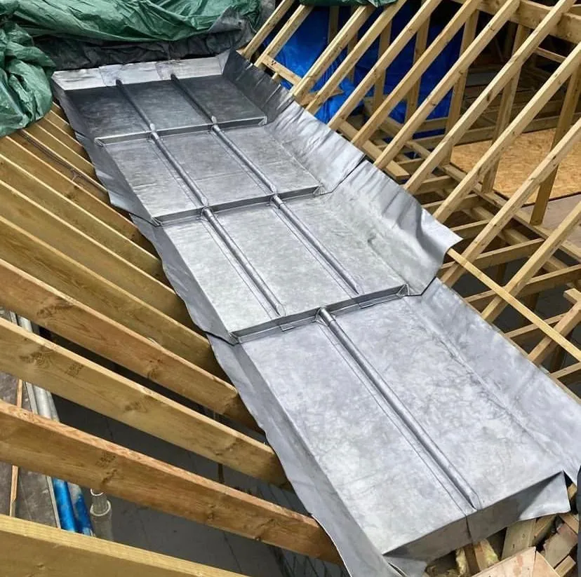 New lead-lined valley gutter between roof timbers, Imperial Roofcraft roofing job in London