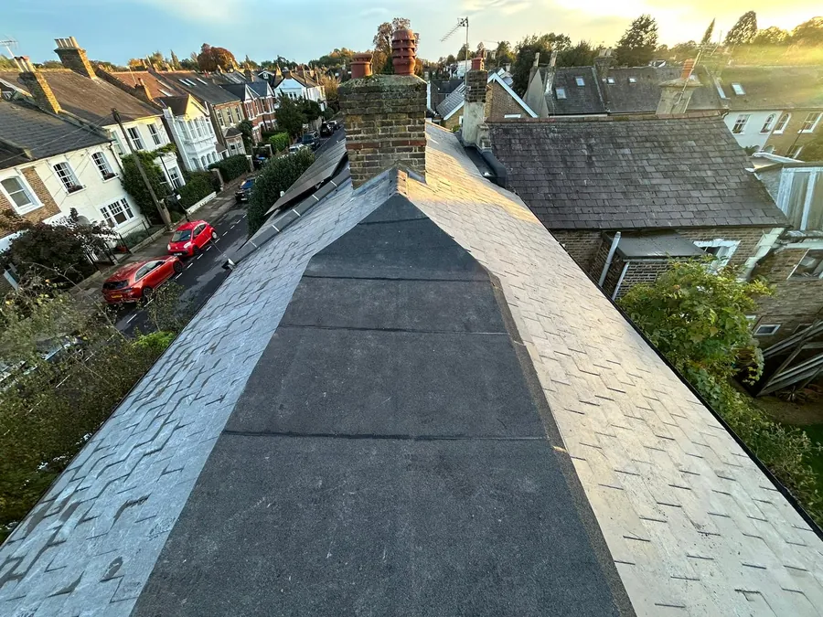 Slate-effect tiled roof and ridge above a residential street, Imperial Roofcraft roofing job in London