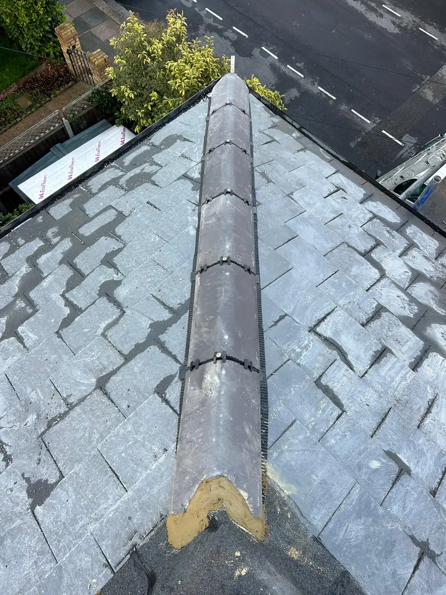 Slate roof with a new ridge running to the eaves, Imperial Roofcraft roofing job in London